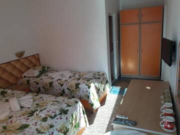 Фото номера Трехместный номер с собственной ванной комнатой Гостевой дом Sianie Guest House г. Равда 13