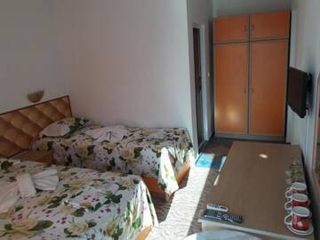 Фото номера Трехместный номер с собственной ванной комнатой Гостевой дом Sianie Guest House г. Равда 4